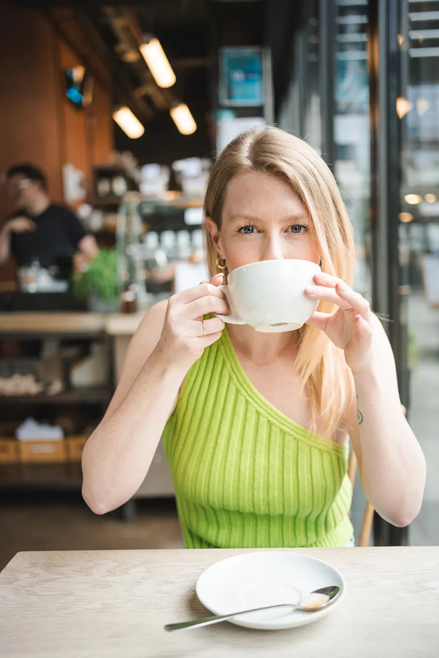 Madison, co-founder of Mad Social, coffee in hand